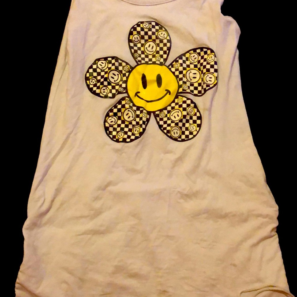 A white dress with a flower on it
